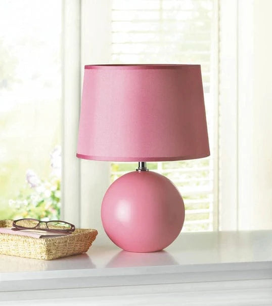 https://cdn.shopify.com/s/files/1/0016/1300/4872/files/faire-zingz-home-table-lamp-pink-round-base-table-lamp-40316585148654.webp?v=1731221800